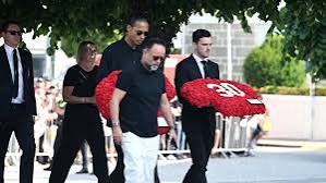 Liverpool players at Jota’s Funeral holding his No. 20 shirt and his brother No. 30 shirt 