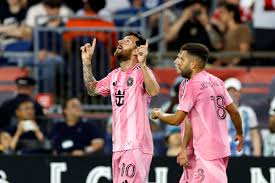 Lionel Messi and Jordi celebrating a goal 